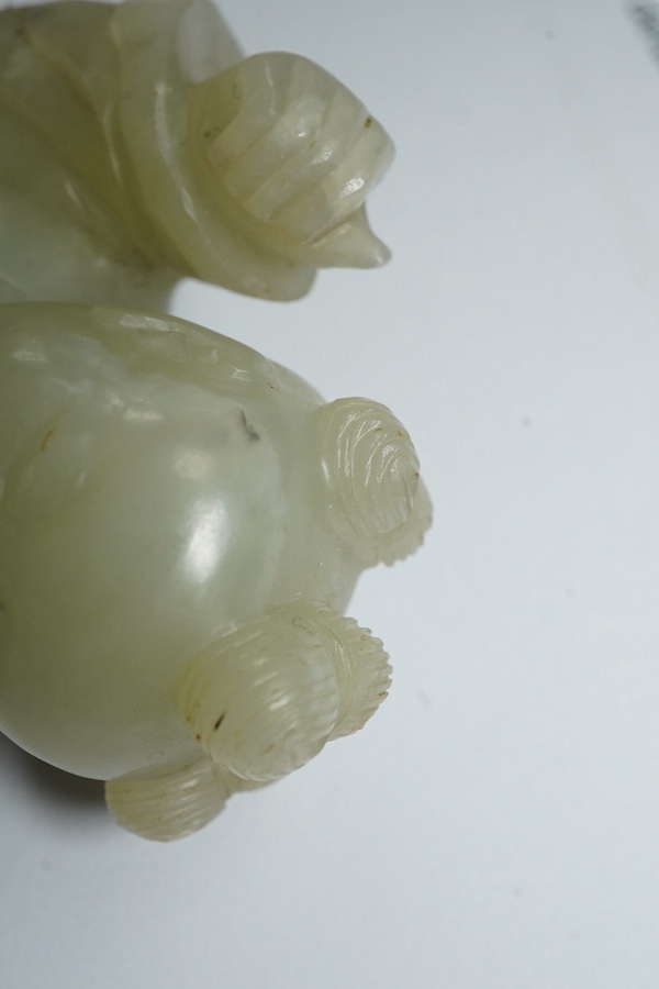 A Chinese pale celadon jade figure of a boy, 18th century